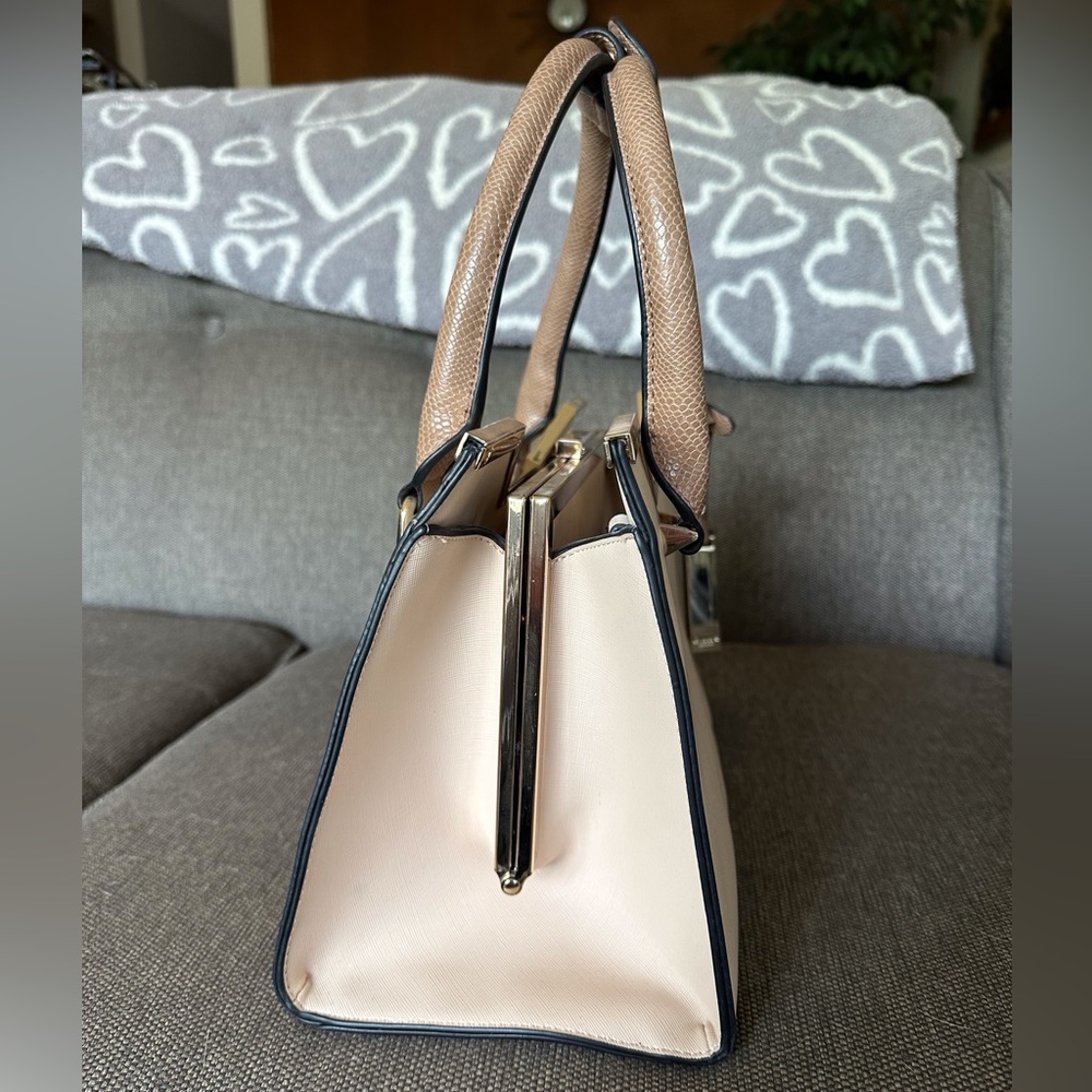 Dune purse Used once at a wedding with slight smudge on side (see photos)